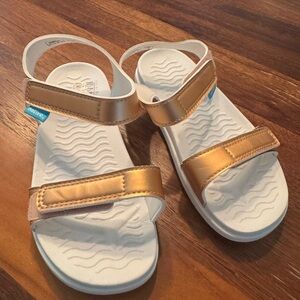 Never worn Kids Gold and White Native Sandals
